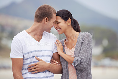 Buy stock photo Happy couple, hug and walking on the beach for travel, forehead touch and together outdoor. Romantic adventure, love and affection for bonding, support and trust with commitment on holiday in Mexico