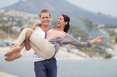Buy stock photo Smile, portrait and man carrying woman in street with freedom, happiness and date on vacation in Mexico. Sea, couple and happy with love in city for romance, travel and adventure on holiday together