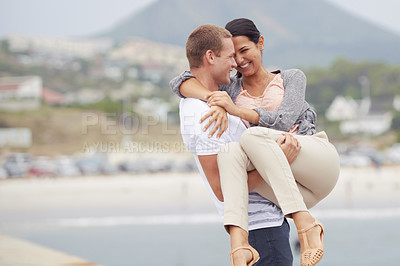 Buy stock photo Smile, love and man carrying woman in street with support, activity and date on vacation in Mexico. Road, couple and happy with embrace in city for romance, travel and adventure on holiday together