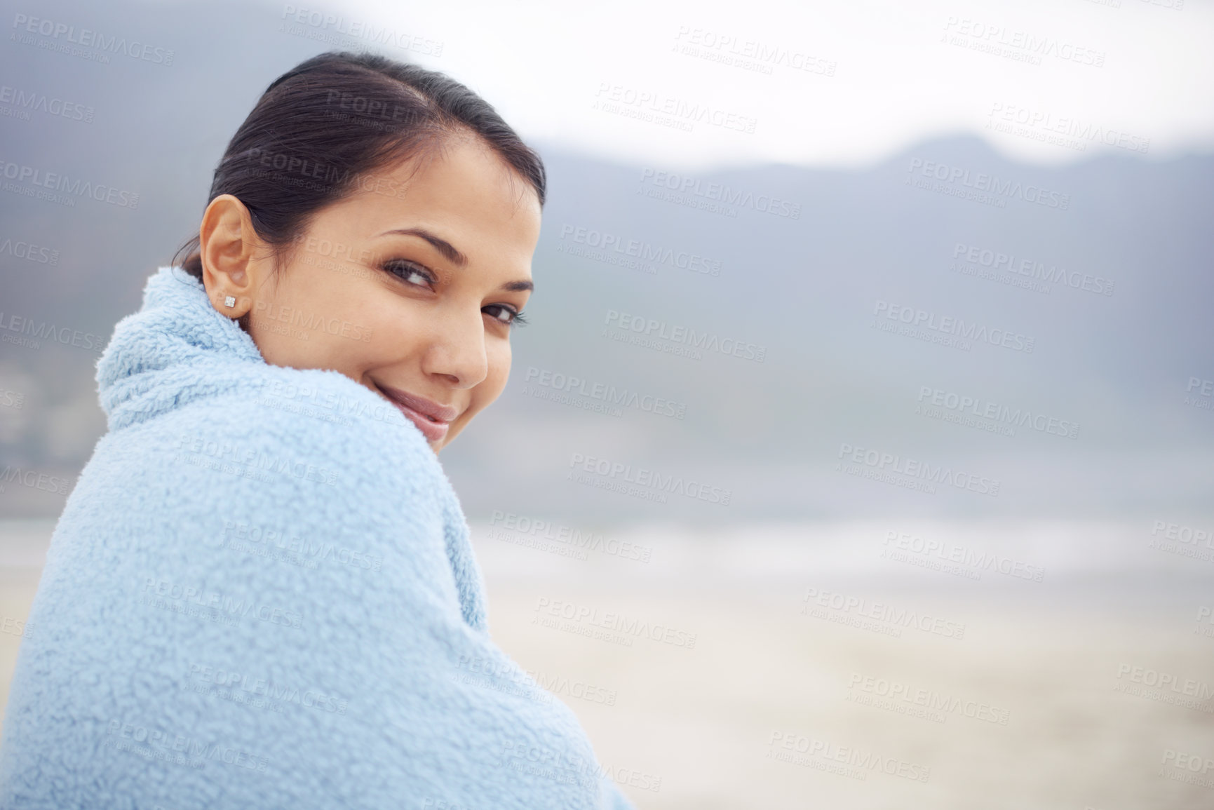 Buy stock photo Woman, towel and ocean with portrait, smile and sand for relax and rest in cape town. Tourist, beach and sea for travel, adventure and holiday with blanket for comfort and positivity in nature
