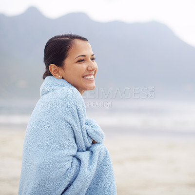 Buy stock photo Shot of an attractive young woman sitting on the beach