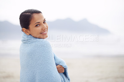 Buy stock photo Woman, towel and beach with portrait, smile and sand for relax and rest in cape town. Tourist, ocean and sea for travel, adventure and holiday with blanket for comfort and positivity in nature