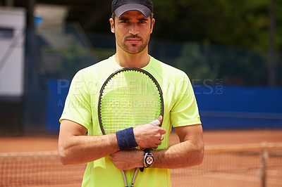 Buy stock photo A male tennis player on a clay court