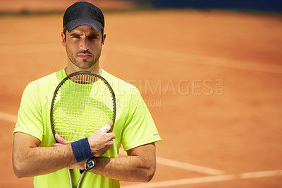 Buy stock photo A male tennis player on a clay court