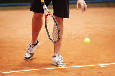 Buy stock photo Athlete, playing and competition on tennis court, serve and racket or ball in professional match. Person, ready and healthy legs in training for tournament, outdoor and skill of strong player in game