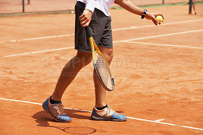 Buy stock photo Man, playing and serve on tennis court, athlete and ball with racket for professional game. Exercise, outdoor sport and person in training for tournament, healthy and stance of champion player in set