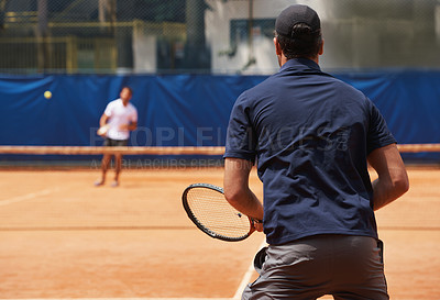 Buy stock photo Fitness, sports and tennis with man on court for competition, game or match in summer from back. Coaching, exercise or training with athlete person and rival outdoor on clay for healthy hobby