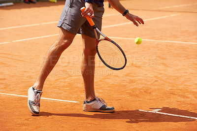 Buy stock photo Tennis, court and legs of person outdoor at start of exercise of workout in competition. Athlete, serving and sneakers of player training with ball on clay pitch in sport, game and action in fitness