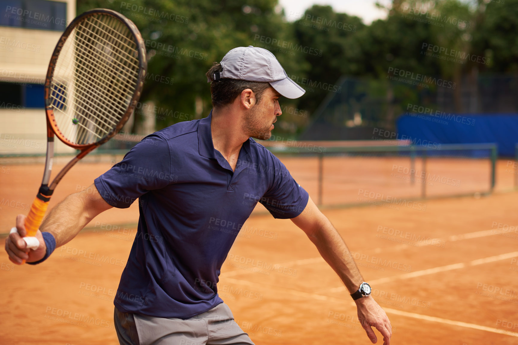 Buy stock photo Tennis, sport and man training in game, competition or exercise for fitness on court. Athlete, workout and play on pitch outdoor in summer with action, challenge and person in contest at club