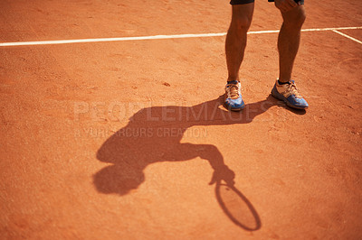 Buy stock photo Tennis, court and shoes of athlete outdoor at start of exercise of workout in competition. Person, shadow and sneakers on feet of player training on clay pitch in game of sport with fitness or action