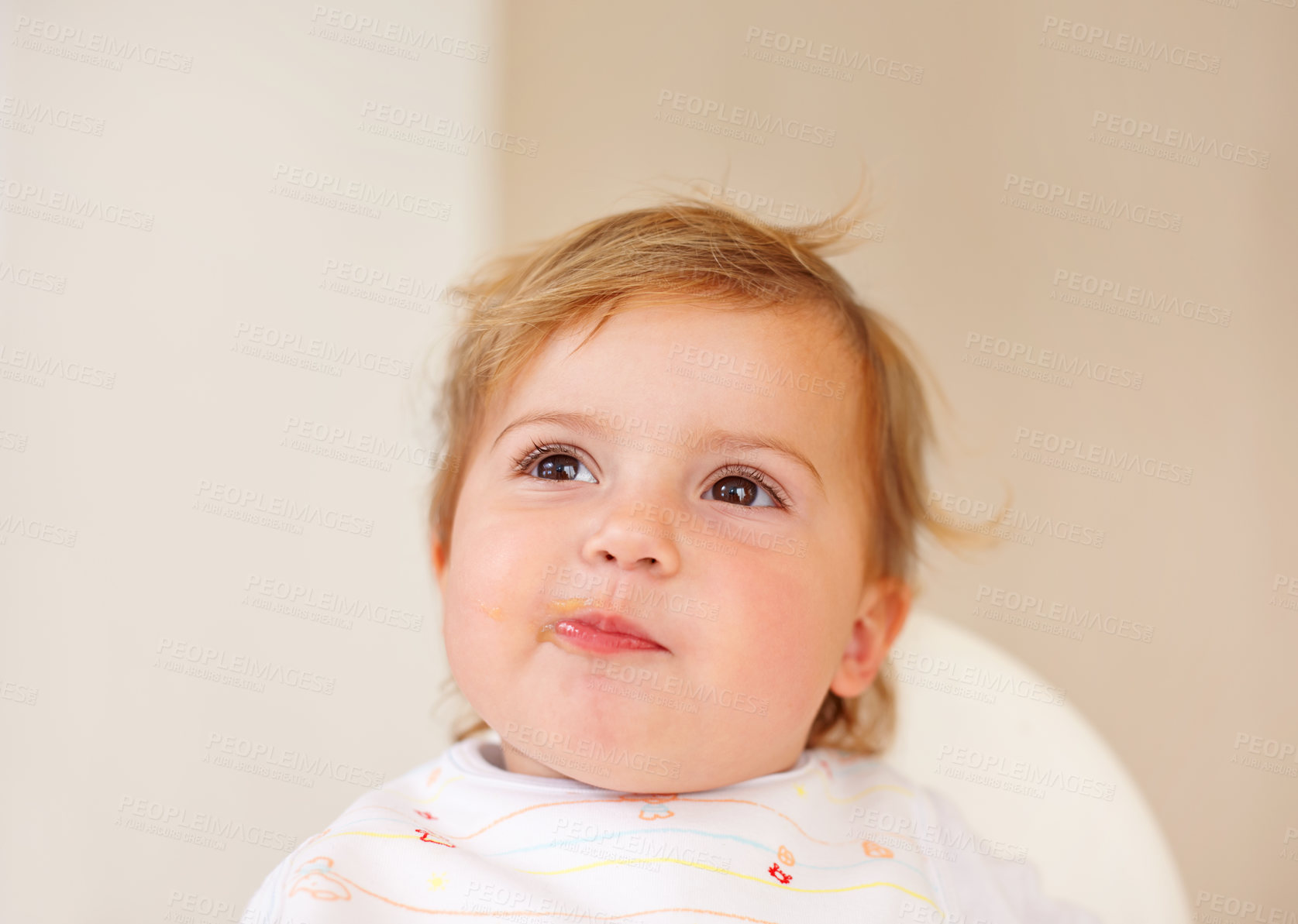 Buy stock photo Happy, baby and eating as thinking of food, tasty and messy for healthy, childhood and development. Smile, cute child and hungry for meal, delicous and nutrition for wellbeing, health and growth