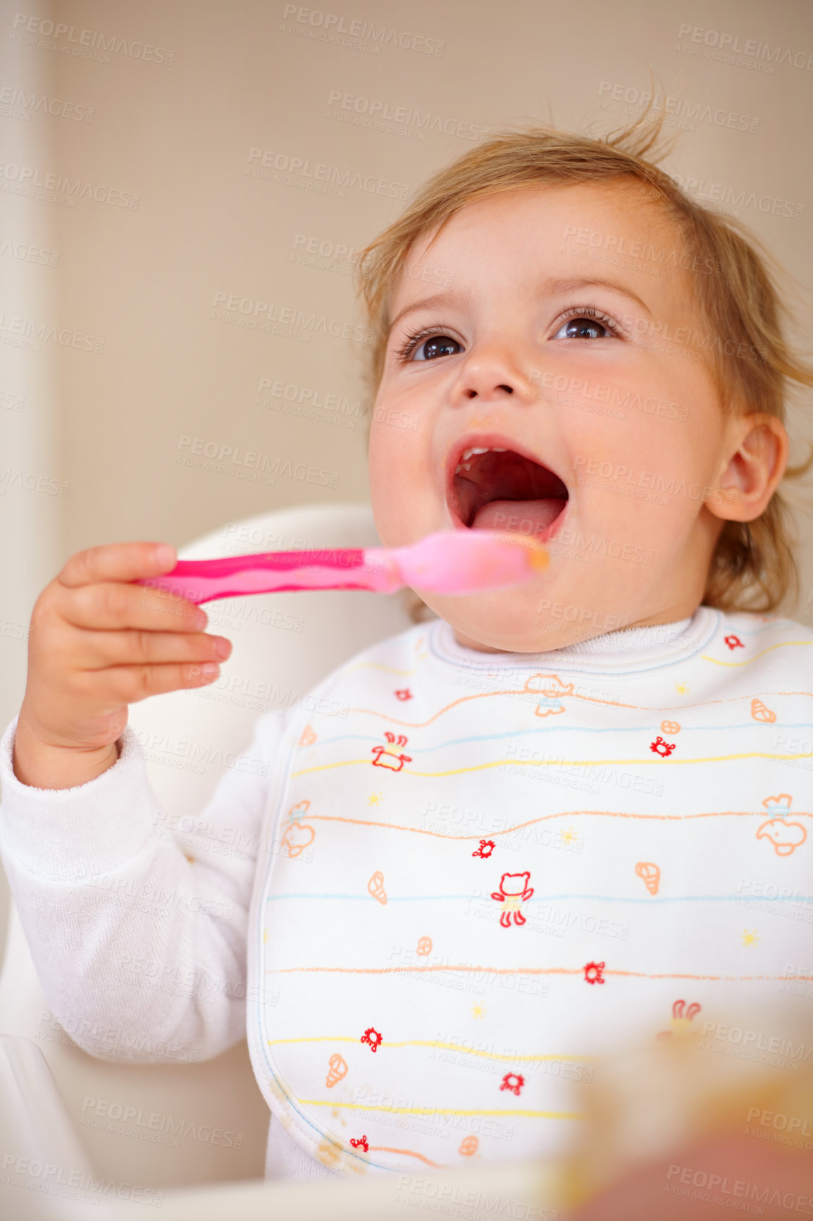 Buy stock photo Baby girl, spoon and eating for nutrition, food and development with happiness at home, house and living room. Female child, infant and kid excited for feeding, breakfast and snack for growth