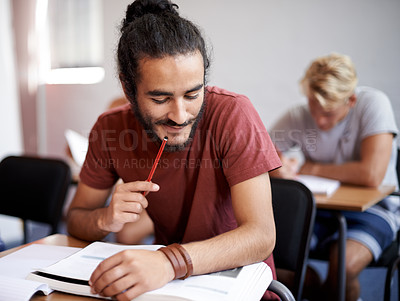 Buy stock photo Man, reading and class with books for thinking, test and solution at university student with education. Person, learning and assessment with ideas, pencil and studying for development in college hall
