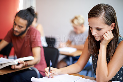 Buy stock photo Woman, writing and class in college, learning and knowledge on campus for education. Student, female person and notes for information in book, planning and research for studying or revision for exams