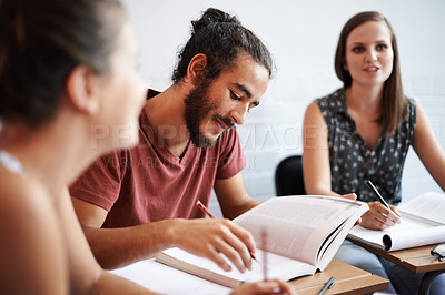Buy stock photo Cropped shot of young college students in class