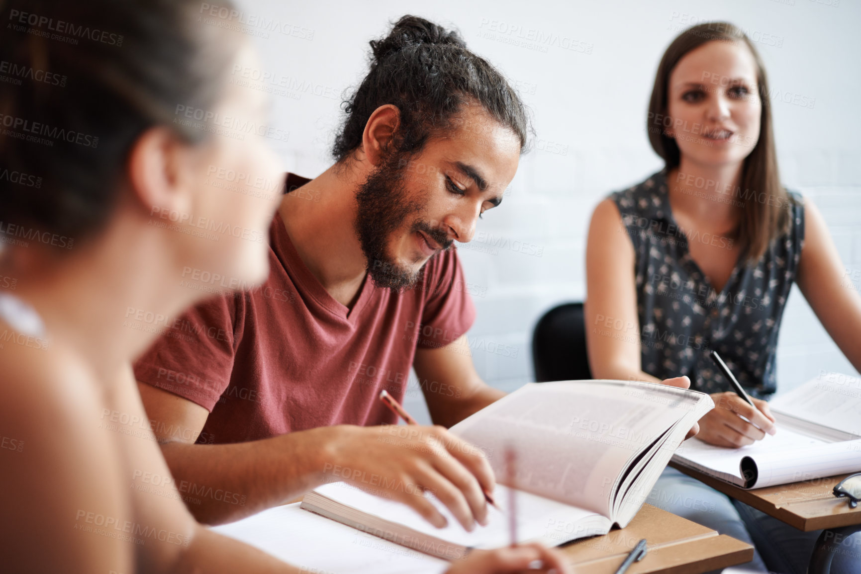 Buy stock photo Cropped shot of young college students in class