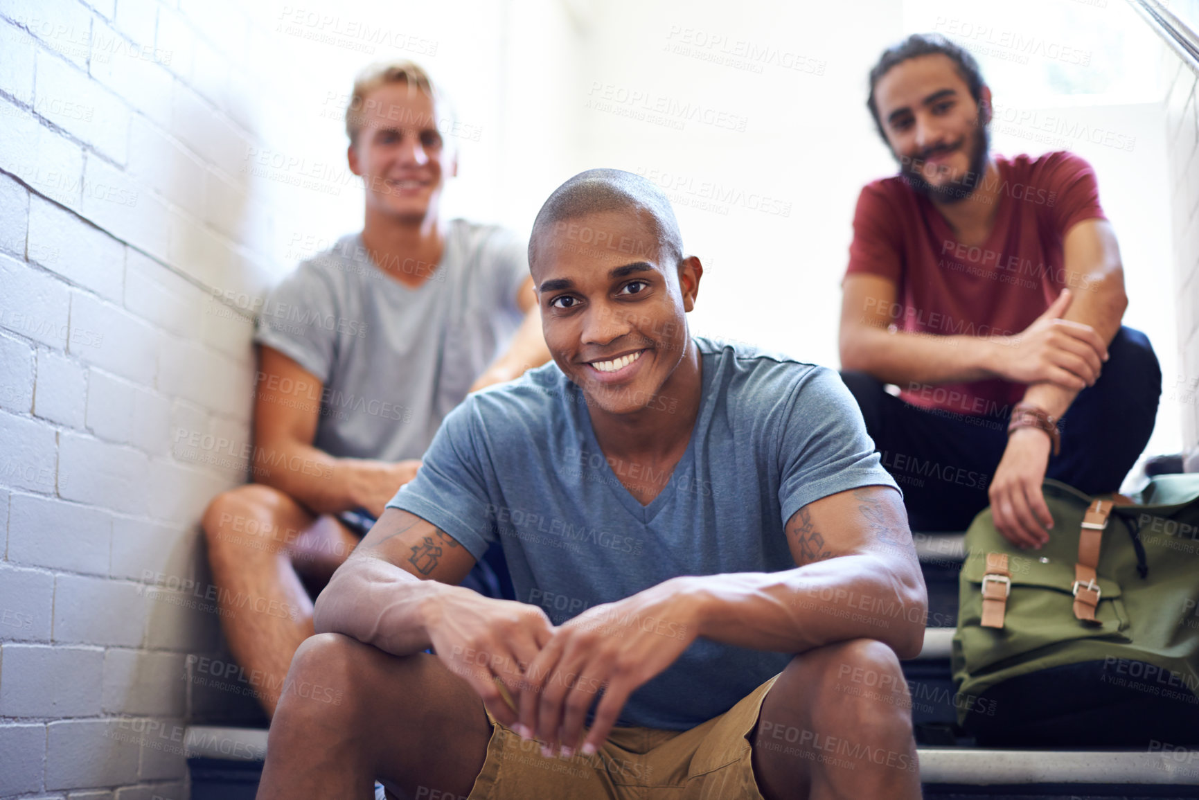 Buy stock photo Portrait, students and happy in university stairs, relaxing and sitting together for break or before class. College people, friends and diversity on campus for education, backpack and casual outfit