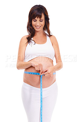 Buy stock photo Woman, smile and pregnant with measure for growth in studio on white background for, happiness, wellness and health. Maternity, mother and isolated with pregnancy for childbirth and future family.