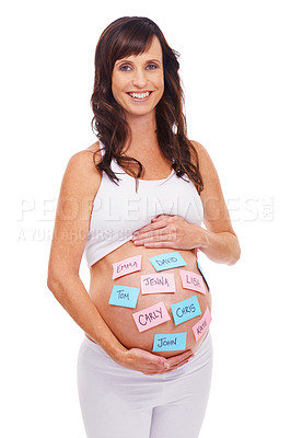 Buy stock photo Portrait, names and sticky notes on stomach of pregnant woman with baby in studio isolated on white background. Smile, choice or decision and happy prenatal mother with idea on belly for maternity