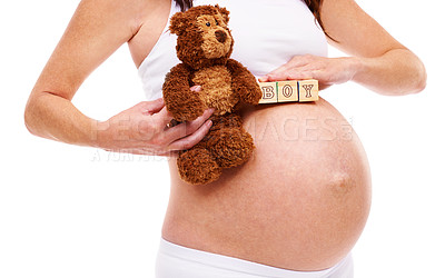 Buy stock photo Woman, pregnant and teddy bear with blocks in studio for announcement, gender reveal and future son. Mother, belly and abdomen with growth for childcare, wellness and maternity on white background