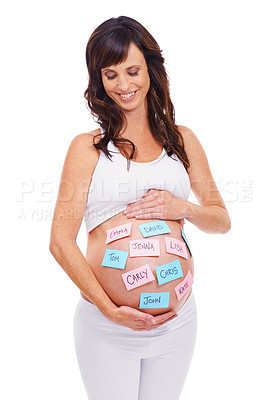 Buy stock photo Smile, names and sticky notes on stomach of pregnant woman in studio isolated on white background. Love, choice or decision and happy young prenatal mother with idea on belly or tummy for maternity