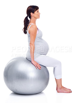 Buy stock photo Pregnant female person, ball and white background for final trimester, wellness and exercise for motherhood. Maternal woman, workout and studio for health, fitness and pregnancy to keep in shape 