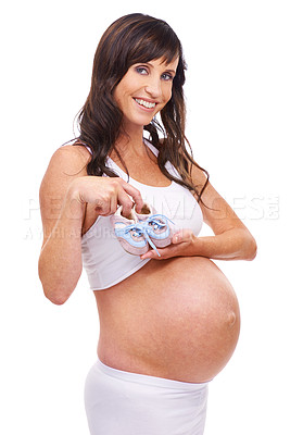 Buy stock photo Woman, pregnant and studio with portrait, smile and baby shoes for maternity and confidence. Mother, proud and confident with pregnancy, child and stomach for positive parenting and motherhood