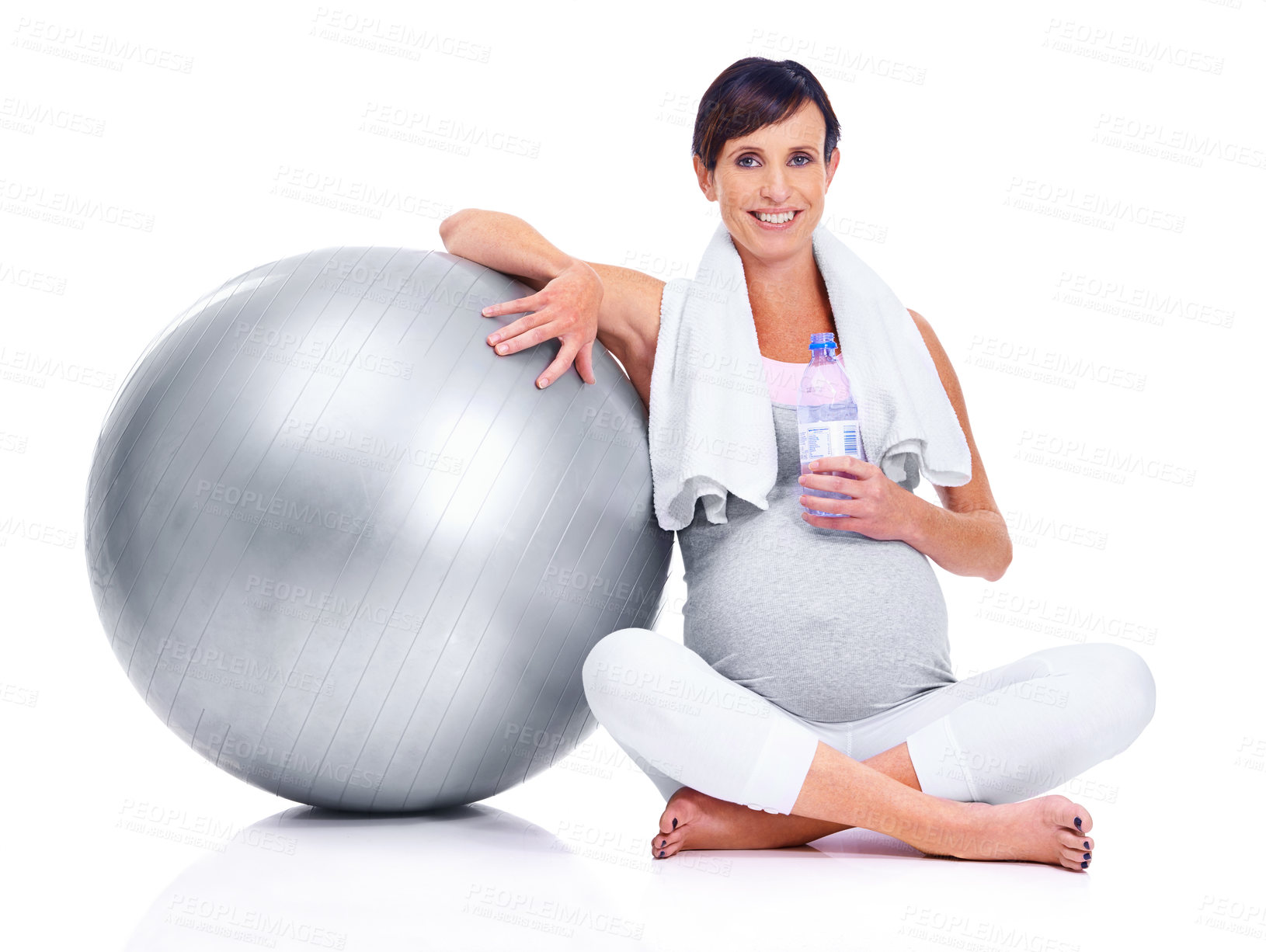 Buy stock photo Pregnant female person, portrait and studio for final trimester, wellness and exercise for motherhood. Maternal woman, workout and white background for health, fitness and ball for towel and water