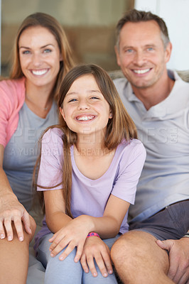 Buy stock photo Mom, dad and girl in portrait on sofa to relax with happy bonding together in family home. Mother, father and daughter with smile on couch with love, weekend fun and support with man, woman and child
