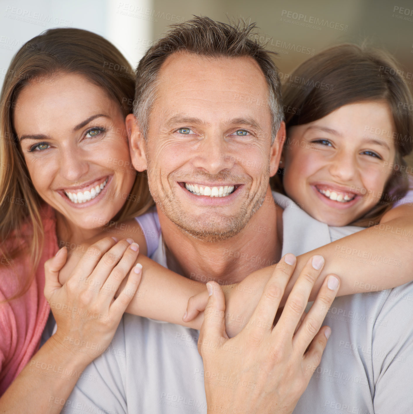 Buy stock photo A young girl with her parents spending time indoors