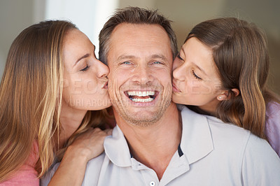 Buy stock photo Mom, dad and girl in portrait with kiss, relax and happy bonding together in family home. Celebration, parents and daughter with smile on fathers day with love, fun and care with man, woman and child