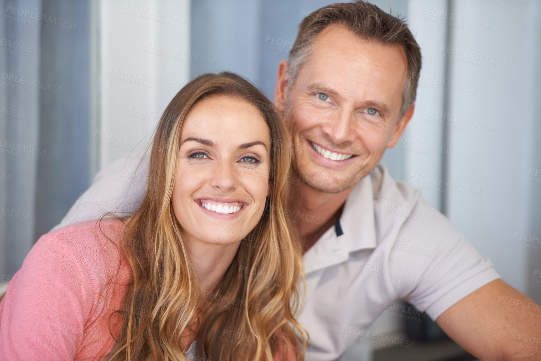 Buy stock photo A cropped shot of a happy couple smiling at the camera