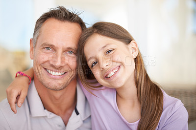 Buy stock photo Portrait, father and daughter hug with smile as happy family in house for bonding in living room. Home, man and dad together with child for weekend, love and quality time with girl for break

