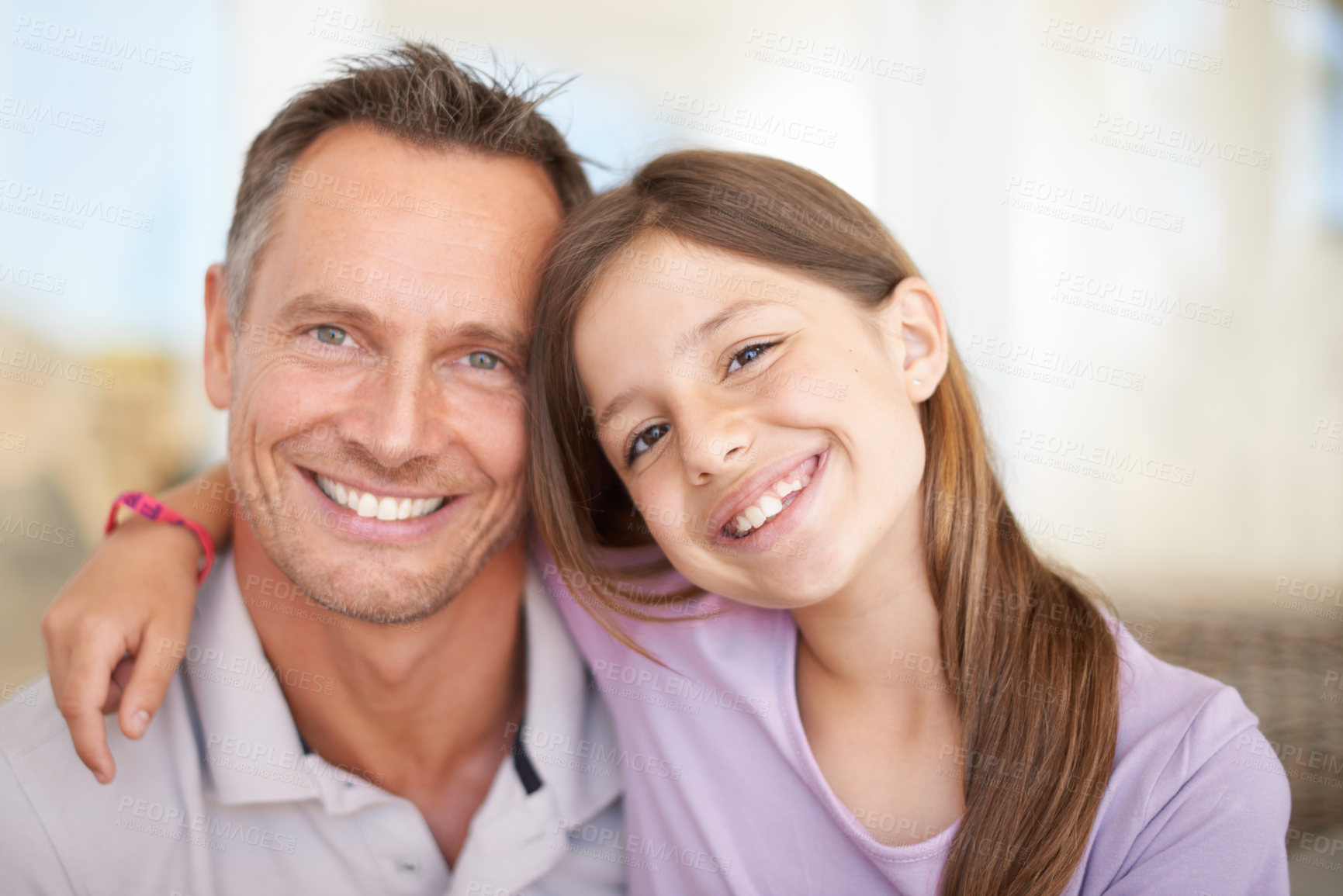 Buy stock photo Portrait, father and daughter hug with smile as happy family in house for bonding in living room. Home, man and dad together with child for weekend, love and quality time with girl for break
