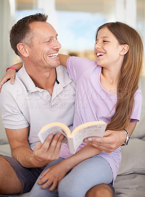 Buy stock photo Father, girl and book on sofa for laughing with hug, care or connection in family home for reading. Dad, child and happy together on couch with teaching, education or embrace for funny story in house