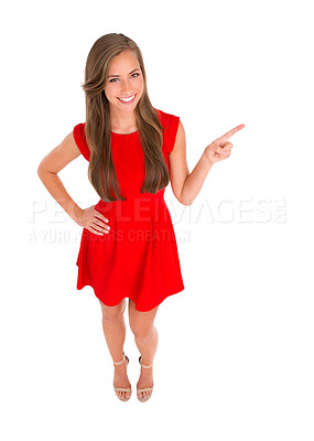 Buy stock photo High angle shot of an attractive young woman pointing to the side against a white background