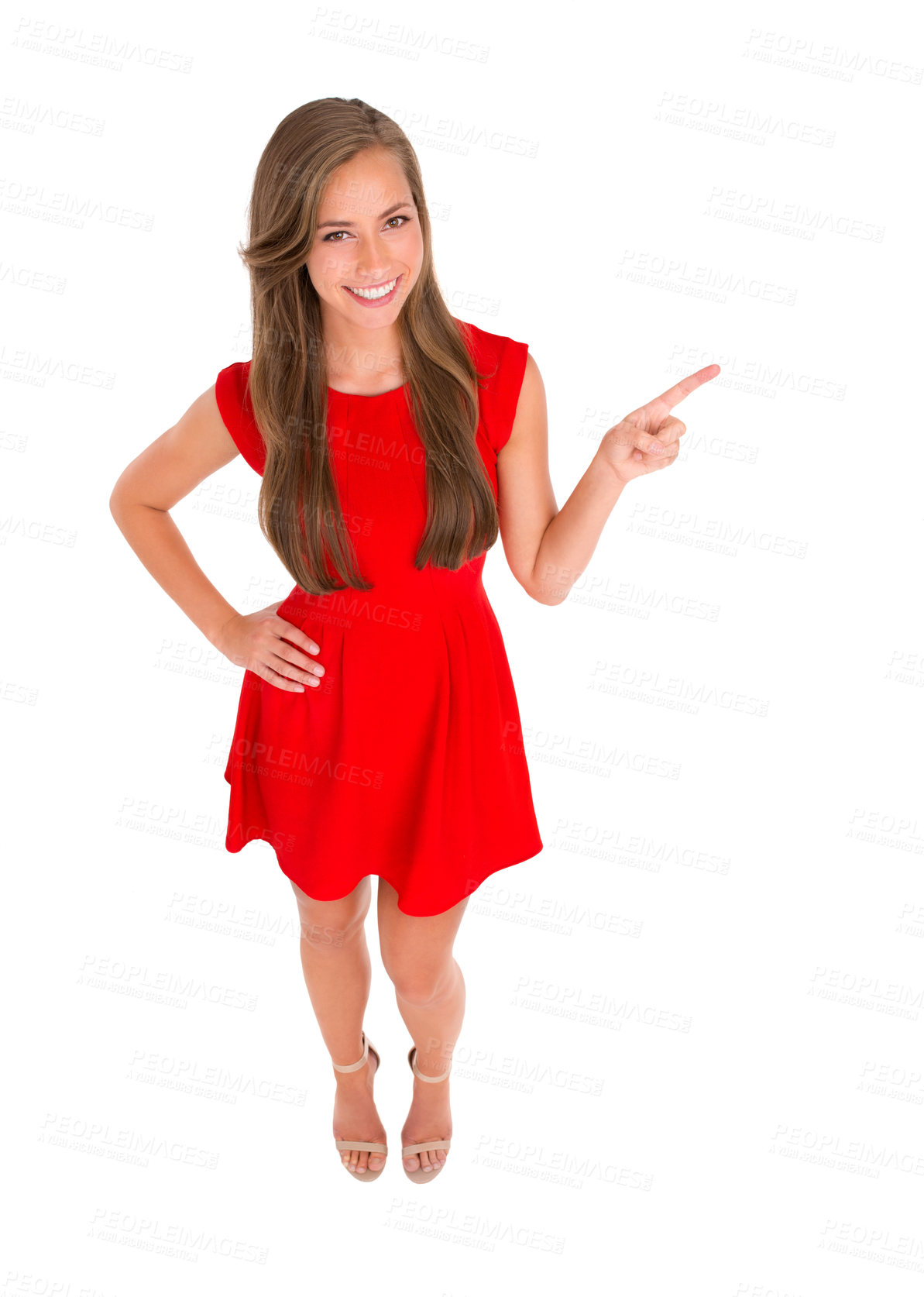 Buy stock photo High angle shot of an attractive young woman pointing to the side against a white background