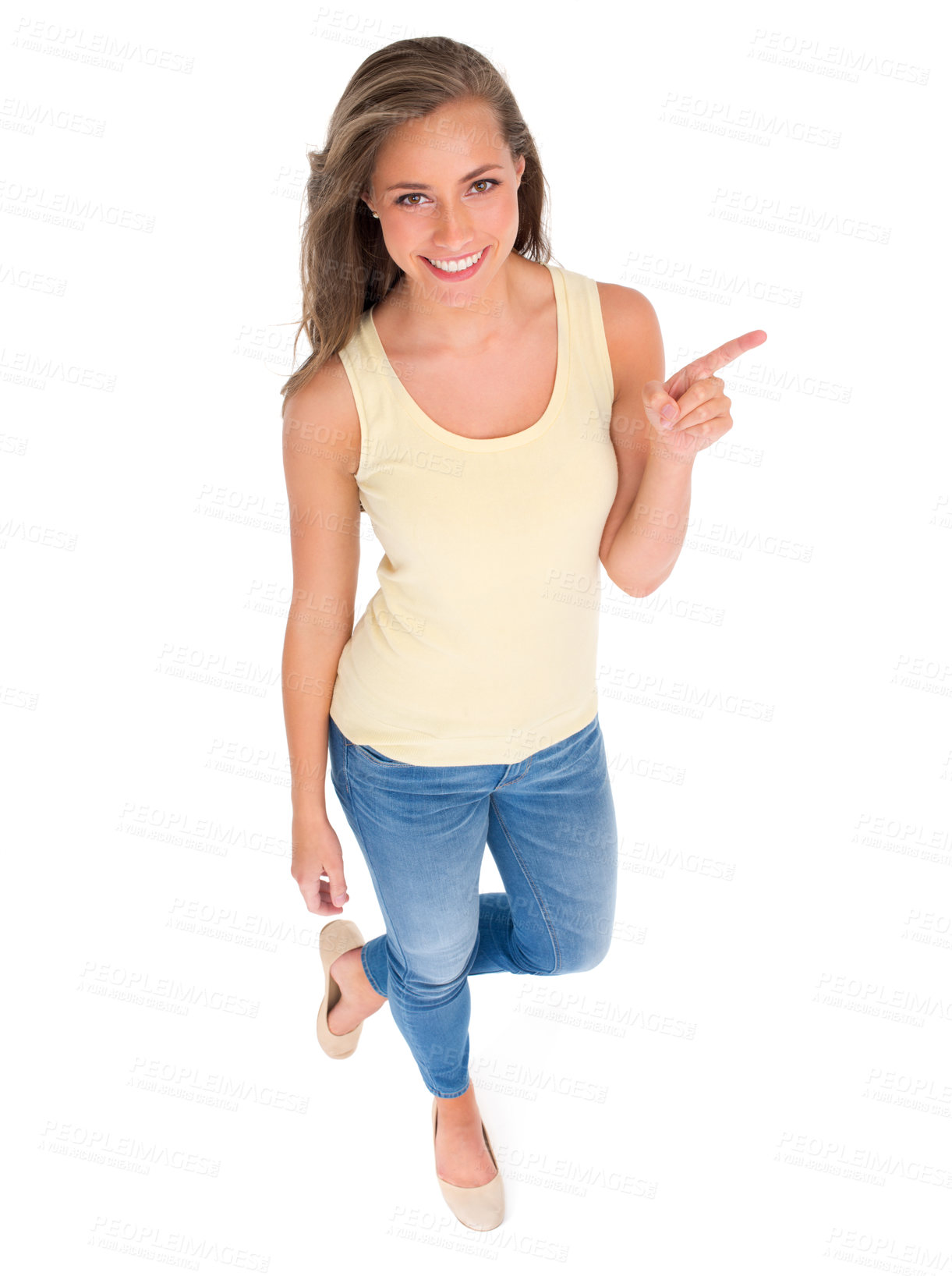 Buy stock photo High angle shot of a beautiful young woman standing against a white background