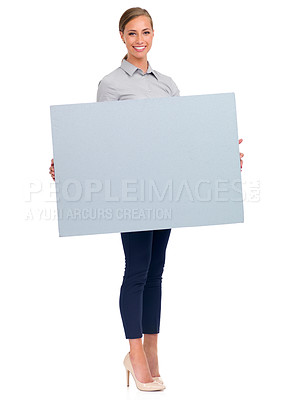 Buy stock photo Full-length studio shot of an attractive young businesswoman holding a blank sign