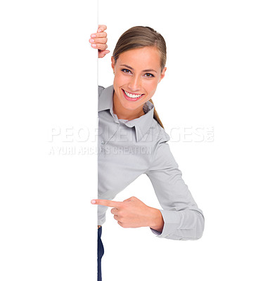 Buy stock photo Pointing, portrait and a woman with a poster for branding isolated on a white background in a studio. Mockup, happy and a brand ambassador with a gesture to signage space for an announcement