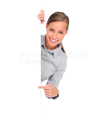 Buy stock photo Pointing, portrait and a woman with a poster for business isolated on a white background in a studio. Mockup, happy and a brand ambassador with blank signage space for advertising and marketing