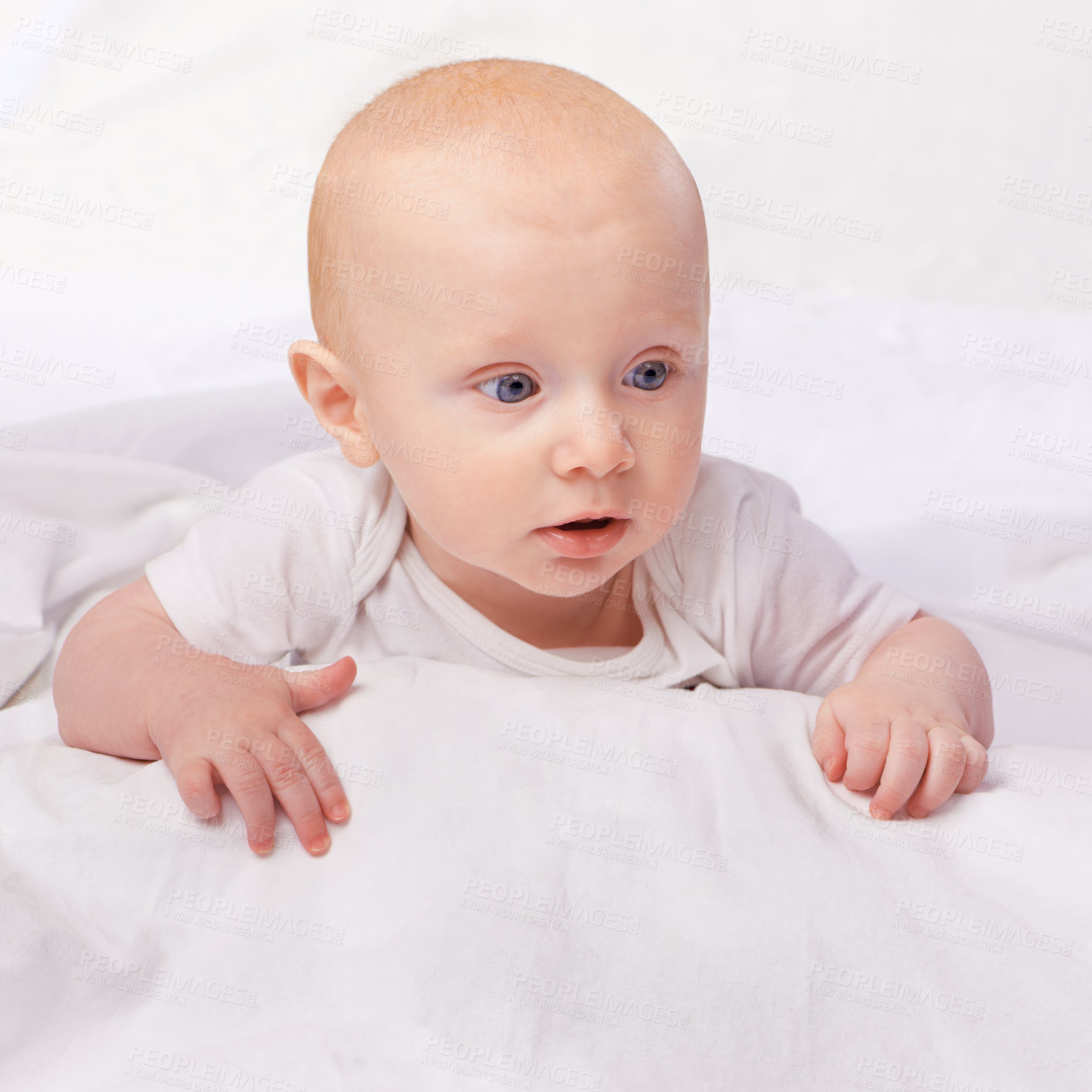 Buy stock photo Cropped shot of an adorable baby boy in a studio