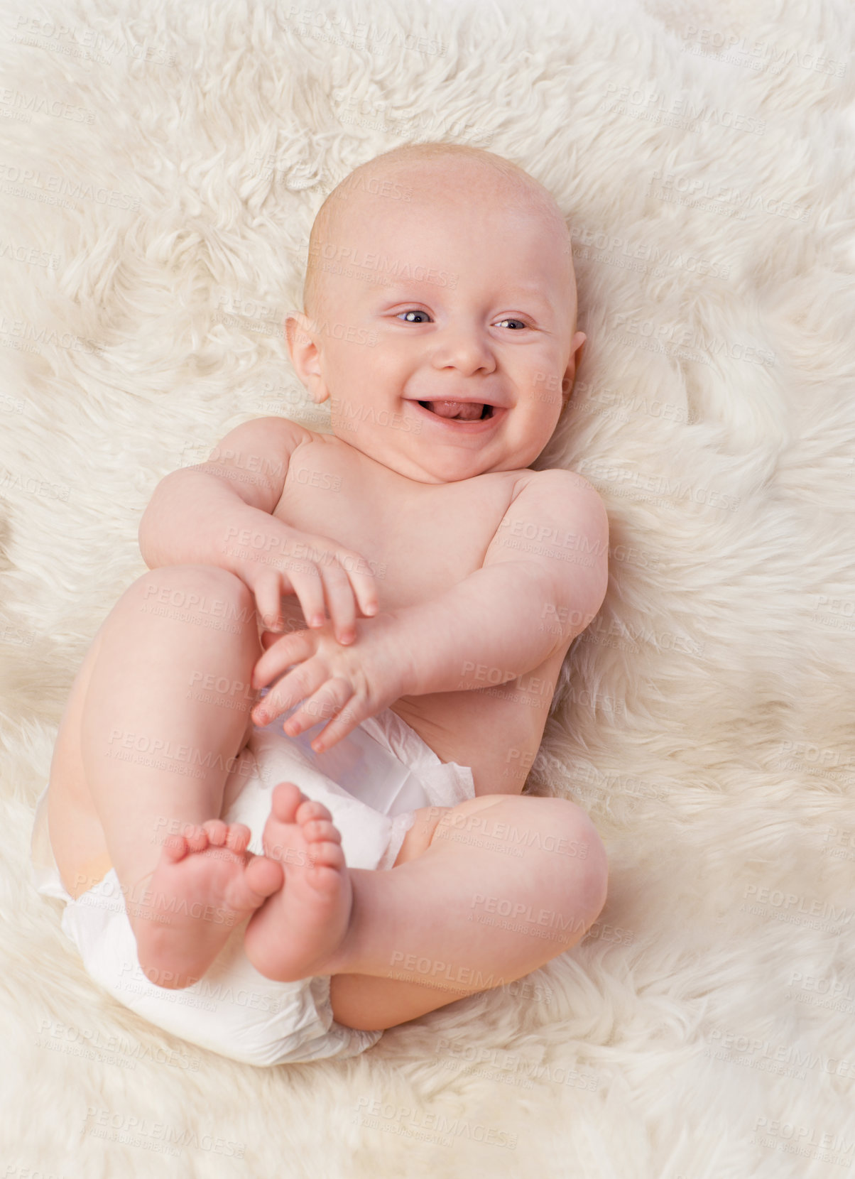 Buy stock photo Baby, cute and laugh in bedroom, blanket and playtime in diaper for child development in happiness. Infant, kid and wellness for newborn, adorable and rug in house for home and toddler fun