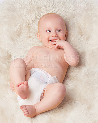 Buy stock photo Cropped shot of an adorable baby boy in a studio