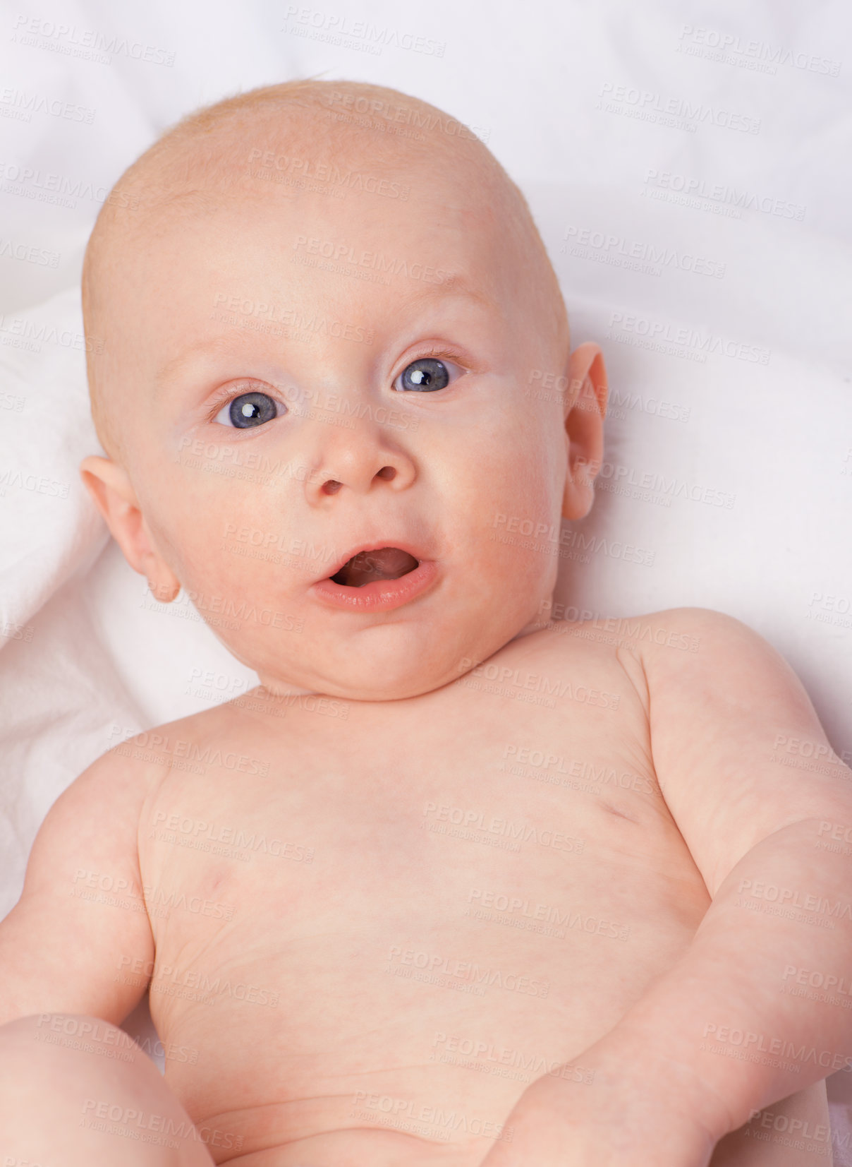 Buy stock photo Cropped shot of an adorable baby boy in a studio