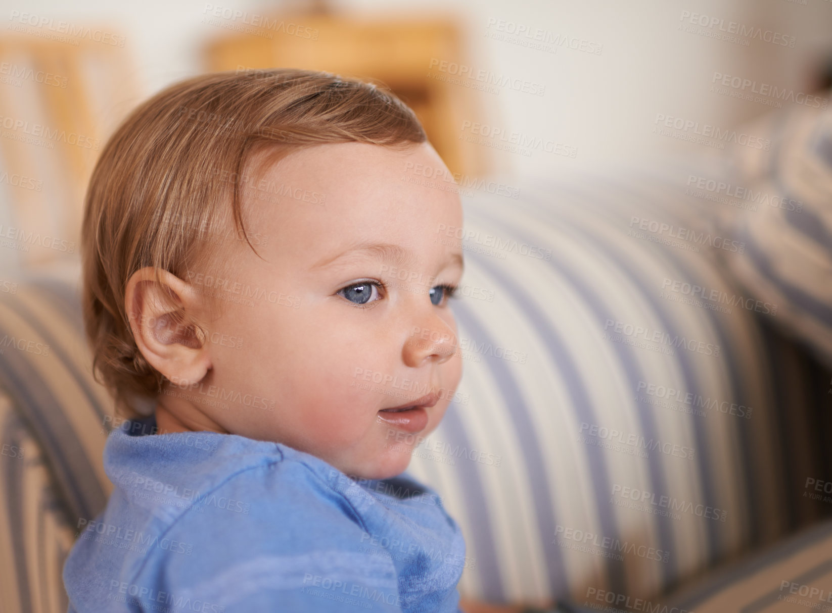 Buy stock photo Baby boy, smile and face profile in sofa relaxing, resting and sitting in living room. Adorable child, growth and development at home kid or infant, happiness and casual outfit or clothes in house