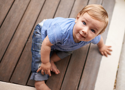 Buy stock photo Floor, above or portrait of baby in home for fun playing, happiness or learning alone on porch. Relax, boy or face of a toddler on ground with smile for child development or growth in house top view