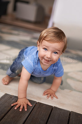 Buy stock photo Floor, crawl and portrait of baby in home for fun playing, happiness and learning alone on ground. Relax, boy and face of a toddler with smile for child development, wellness or growth in a house