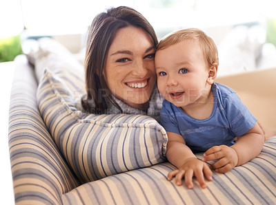 Buy stock photo Mother, baby and portrait for love in embrace, care and support or relax in living room and comfortable. Mommy, son and affection for bonding in childhood, security and hug on couch or smile on face