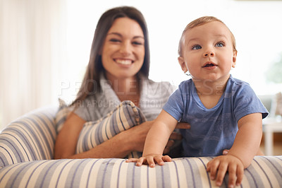 Buy stock photo Mother, baby and love in portrait on couch, care and support or smile in living room and comfortable. Mommy, son and trust for bonding in childhood, single parent and happy for childcare on weekend
